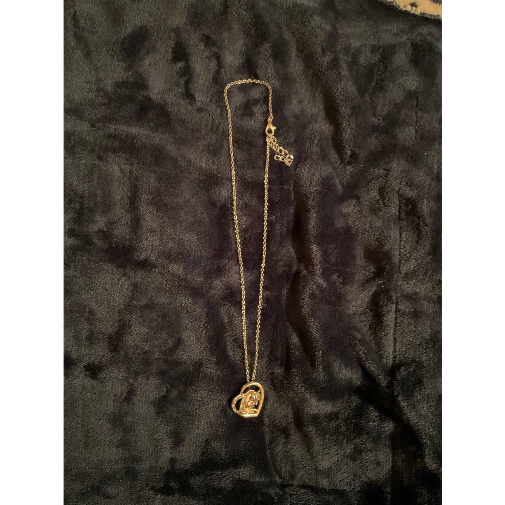 Unicorn in a heart pendant necklace.    0179